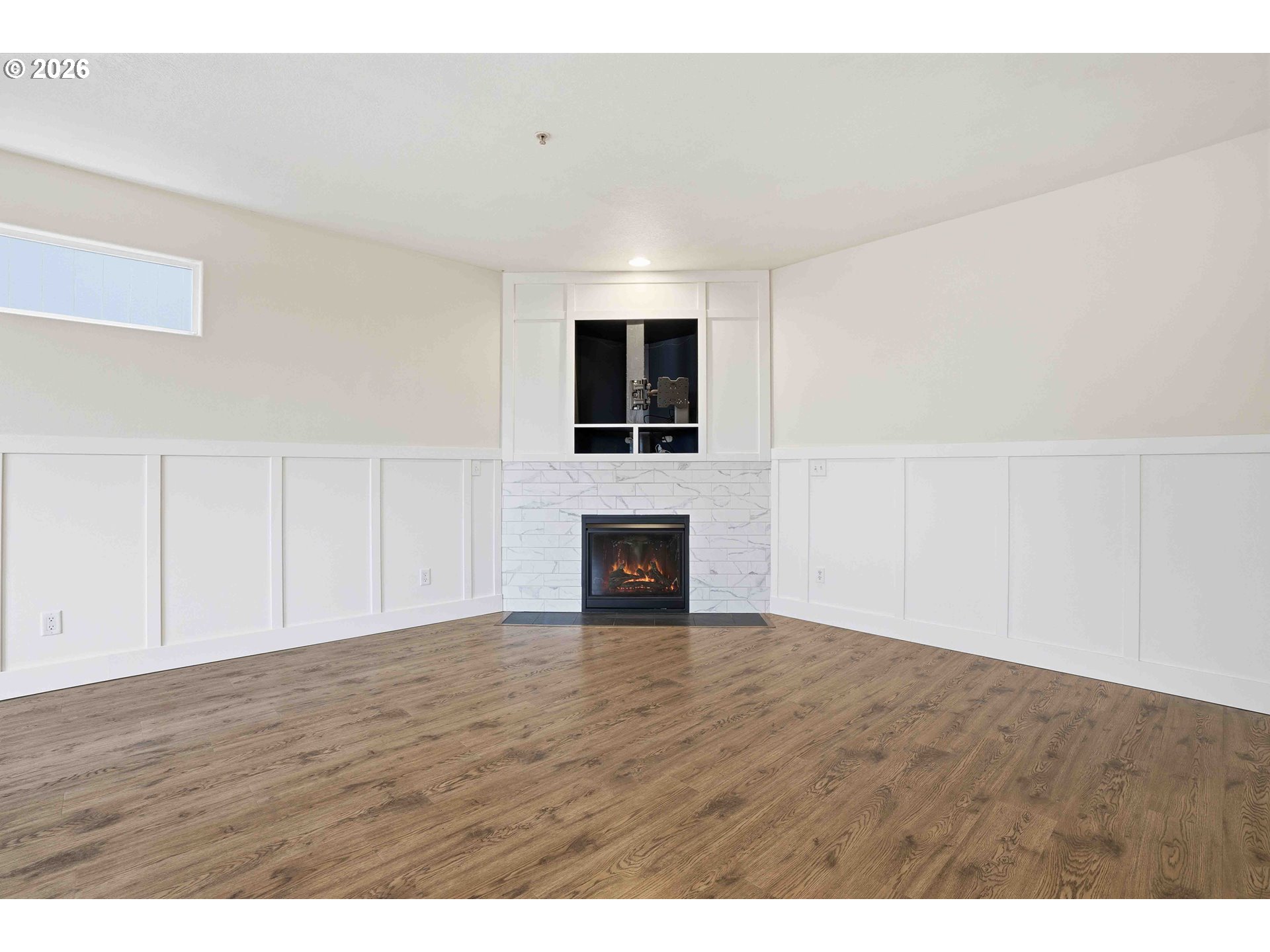 3323 Northwest 31st Circle Camas, WA 98607 - Photo 7 of 25 a view of empty room with a fireplace and wooden floor