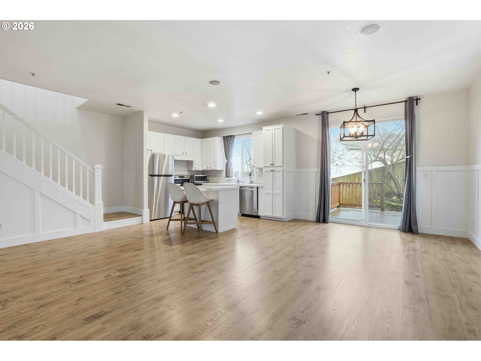 3323 Northwest 31st Circle Camas, WA 98607 - Photo 8 of 25 a view of a kitchen with furniture and wooden floor