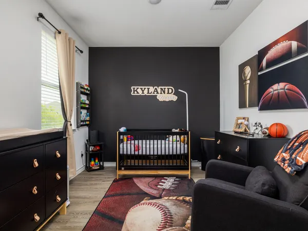 a bedroom with furniture and a window