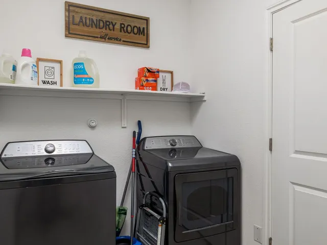 a utility room with dryer and washer