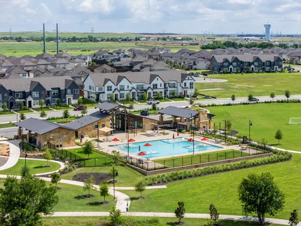 an aerial view of a house with outdoor space