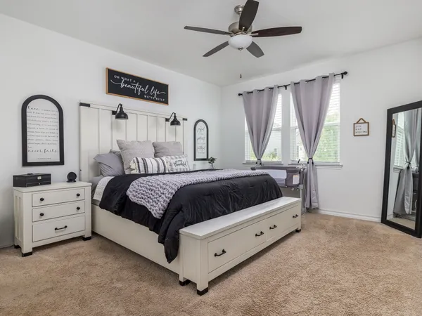 a bedroom with a bed and a dresser