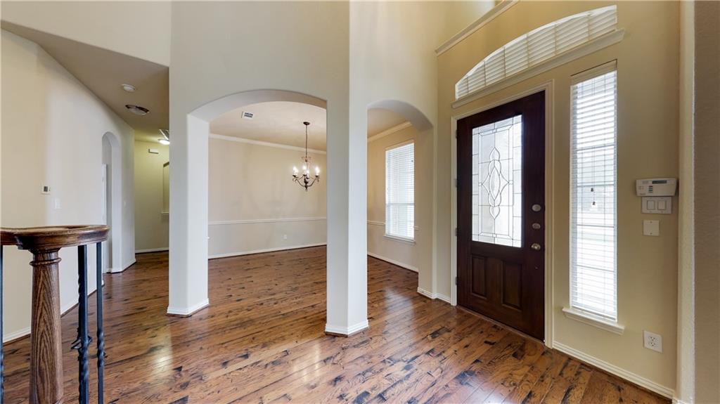 7136 Playa Grand Prairie, TX 75054 - Photo 13 of 36 a view of a hallway with wooden floor and staircase