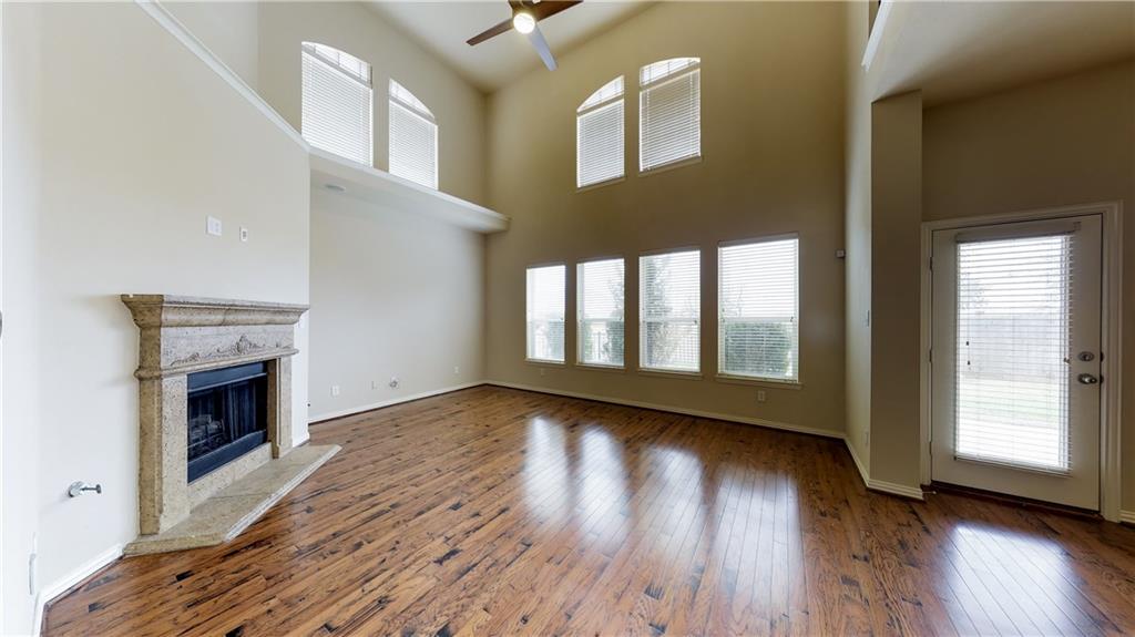 7136 Playa Grand Prairie, TX 75054 - Photo 15 of 36 a view of an empty room with exposed radiator and fireplace