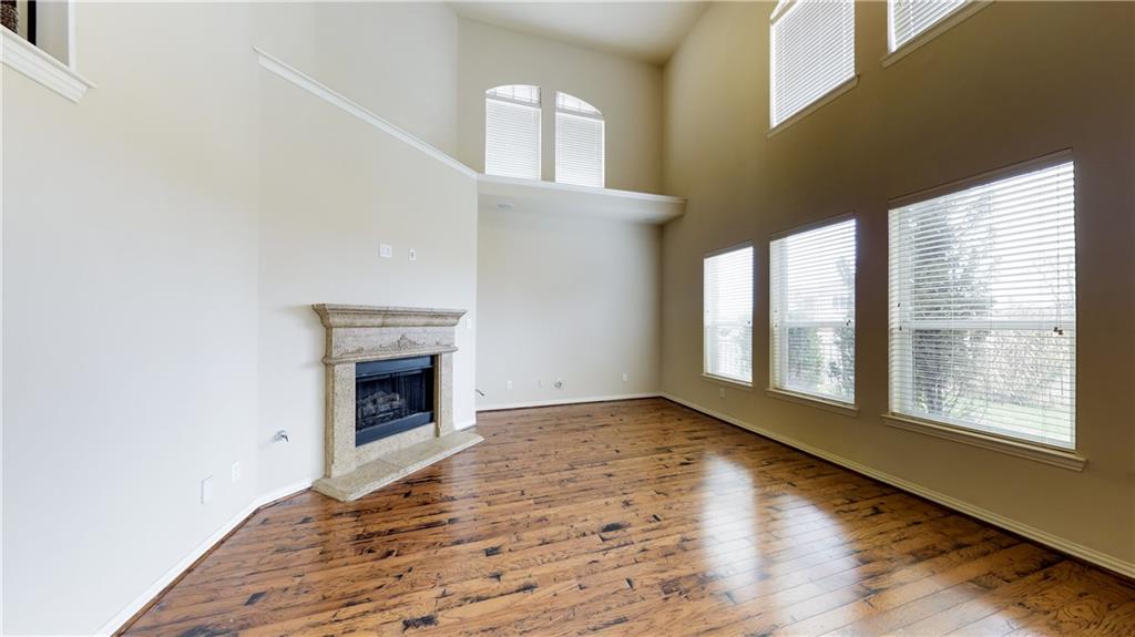 7136 Playa Grand Prairie, TX 75054 - Photo 17 of 36 a view of an empty room with a window and fireplace