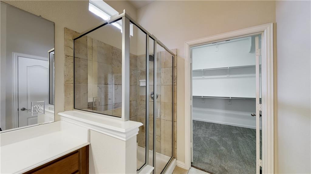 7136 Playa Grand Prairie, TX 75054 - Photo 30 of 36 a bathroom with a shower sink and mirror