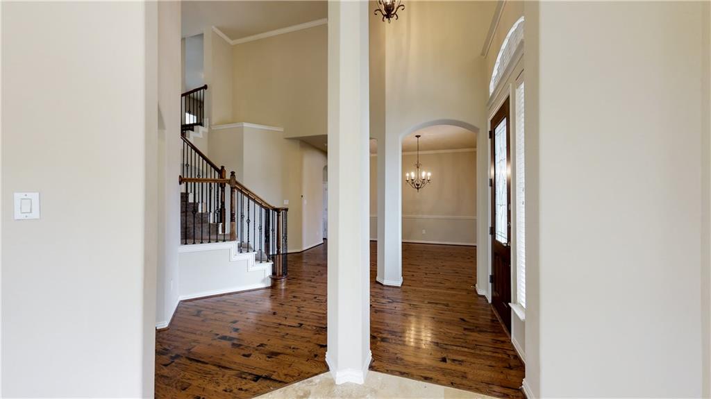7136 Playa Grand Prairie, TX 75054 - Photo 6 of 36 a view of a hallway with wooden floor and staircase