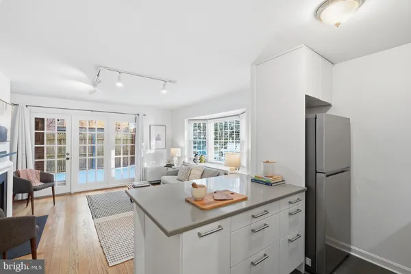 a view of a kitchen area with furniture and windows