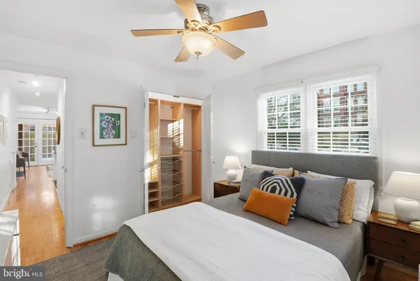 a bedroom with a large bed and a window