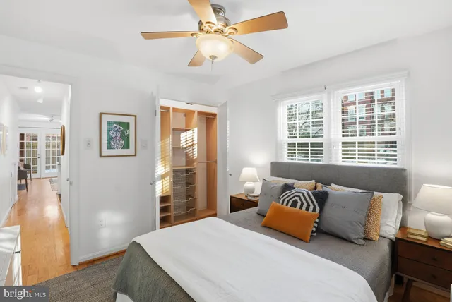 a bedroom with a large bed and a window