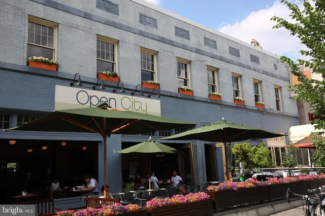 a view of a cafe with sitting area