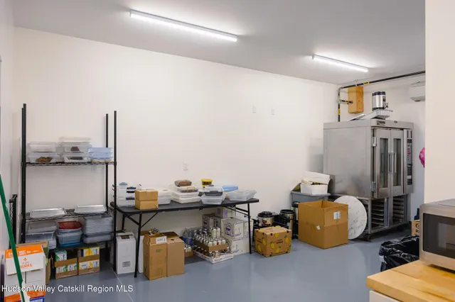 a living room with kitchen island furniture and a window