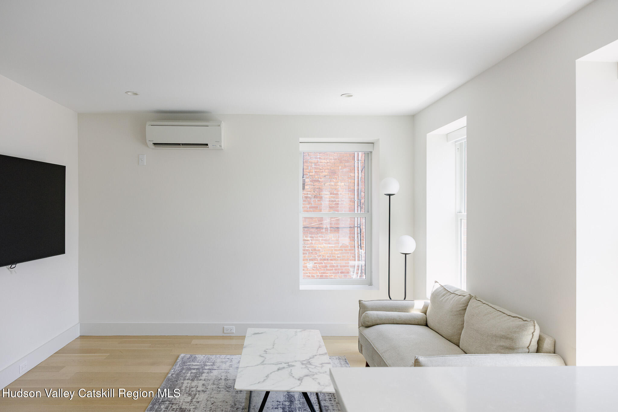 320 Main Street Middleburgh, NY 12122 - Photo 15 of 29 a living room with furniture and a flat screen tv