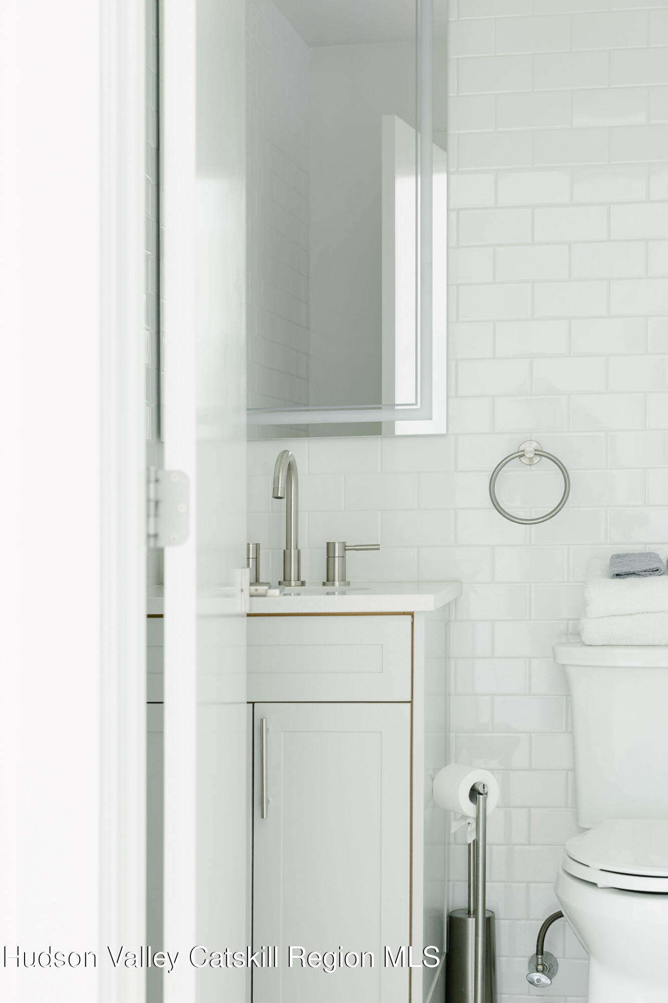 320 Main Street Middleburgh, NY 12122 - Photo 17 of 29 a bathroom with a sink a toilet and a mirror