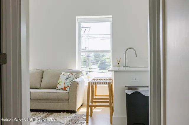a bedroom with a bed and a night stand