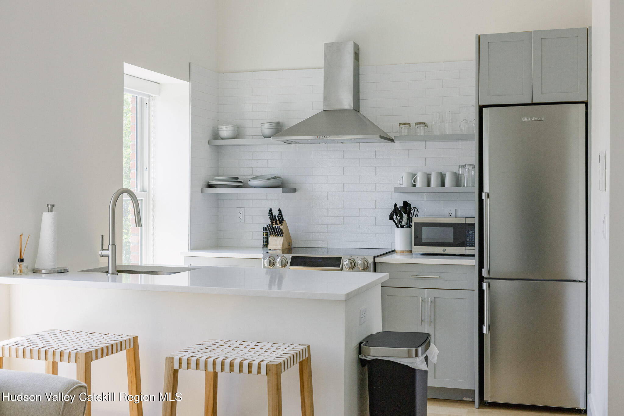 320 Main Street Middleburgh, NY 12122 - Photo 20 of 29 a kitchen with stainless steel appliances a refrigerator and a sink