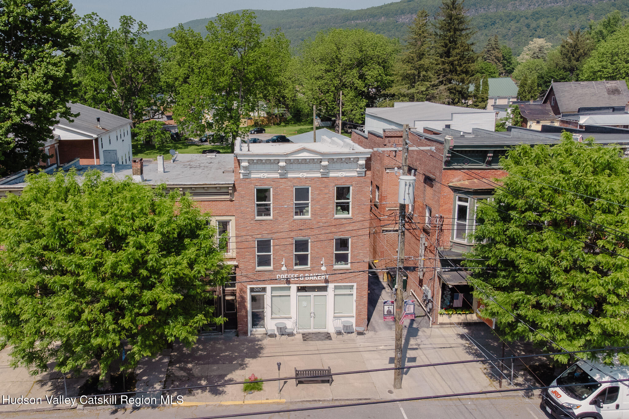 320 Main Street Middleburgh, NY 12122 - Photo 27 of 29 a large building with a clock tower in the middle