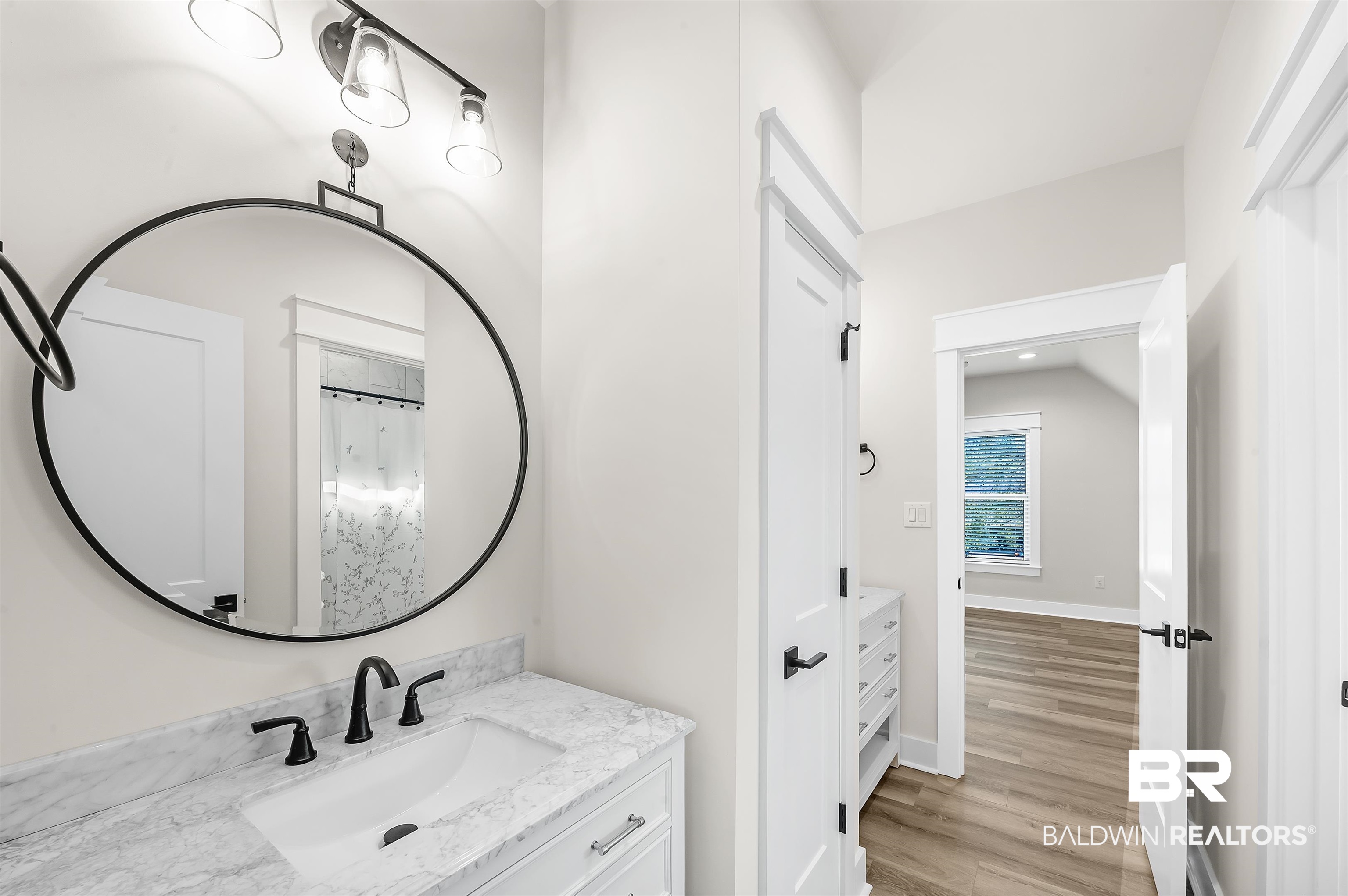 9144 Harvest Ridge Fairhope, AL 36532 - Photo 45 of 58 Bathroom with vanity, baseboards, and wood finished floors