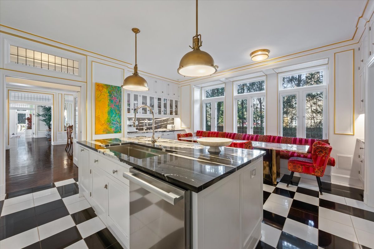 919 Hill Road Winnetka, IL 60093 - Photo 13 of 57 a kitchen with stainless steel appliances granite countertop a sink and a dining table view