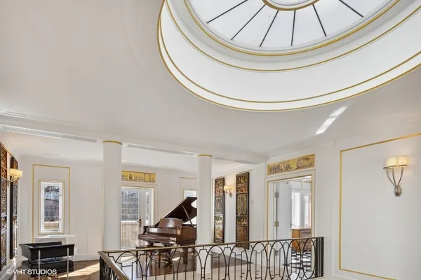 a bathroom with a granite countertop sink a mirror and a bathtub