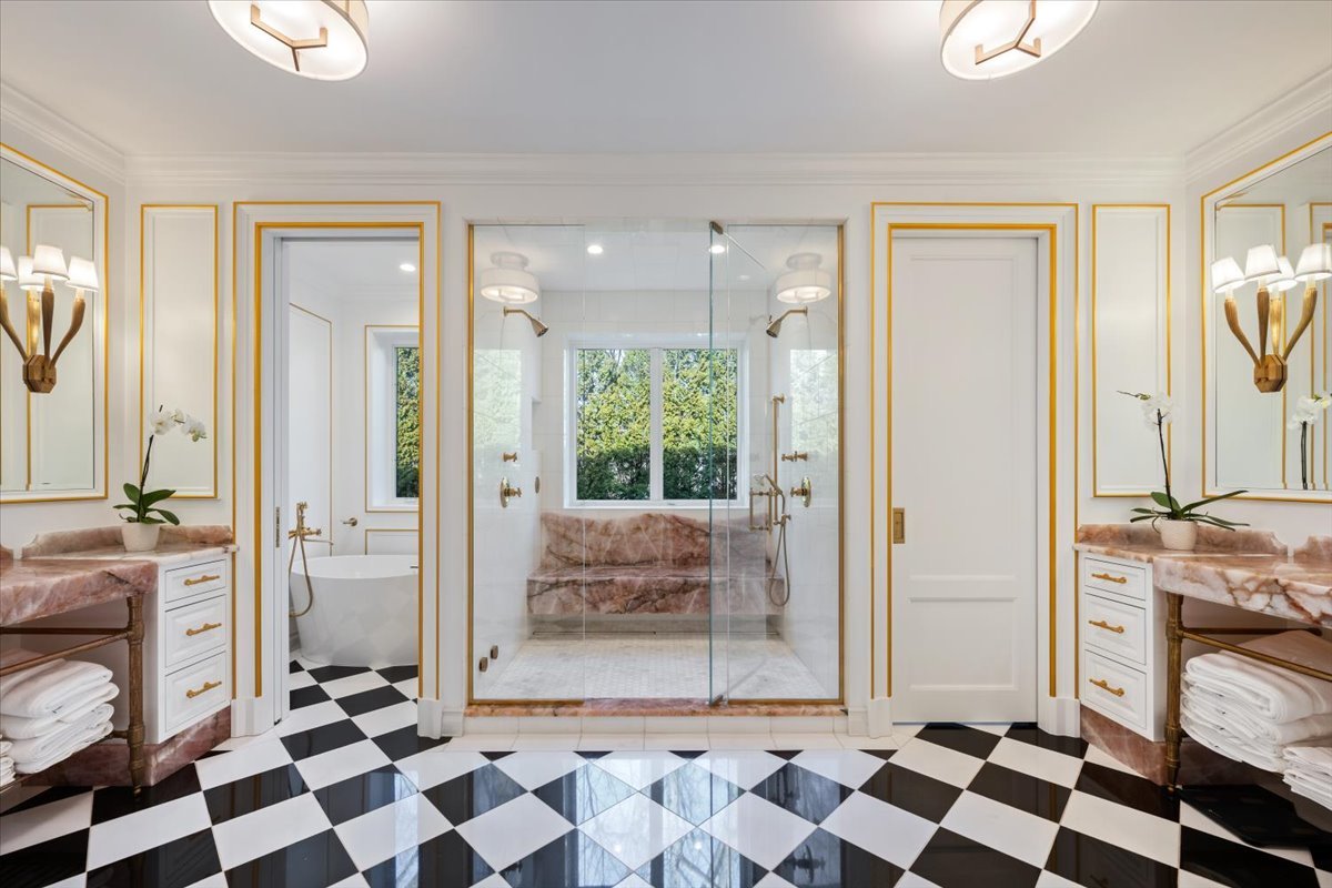 919 Hill Road Winnetka, IL 60093 - Photo 26 of 57 a room with a black white checkered floor with a gaming machine and a rug