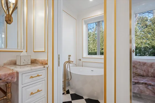 a bathroom with a granite countertop sink a shower and a mirror