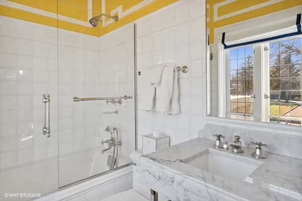 a living room with fireplace furniture and a wooden floor