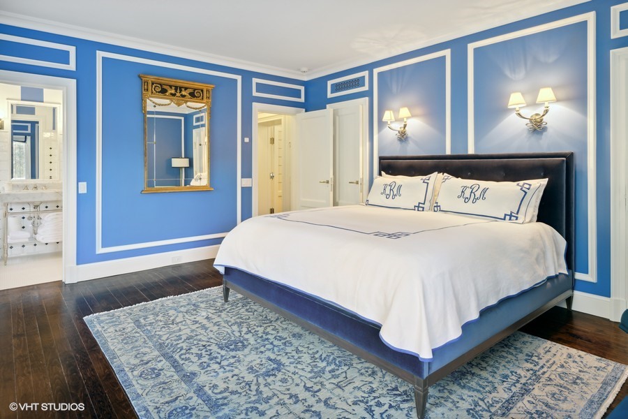 919 Hill Road Winnetka, IL 60093 - Photo 35 of 57 a bedroom with a bed and dresser with mirror