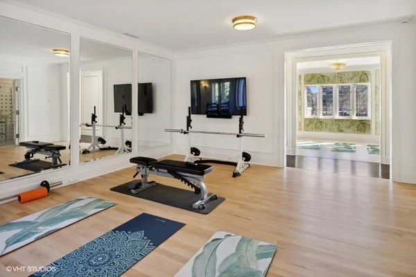 a room with gym equipment and white walls