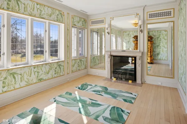 a kitchen with white cabinets and table
