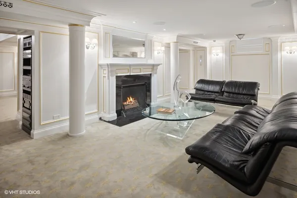 a view of a hallway with wooden floor and windows