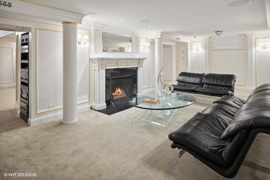 919 Hill Road Winnetka, IL 60093 - Photo 38 of 57 a living room with furniture and a fireplace