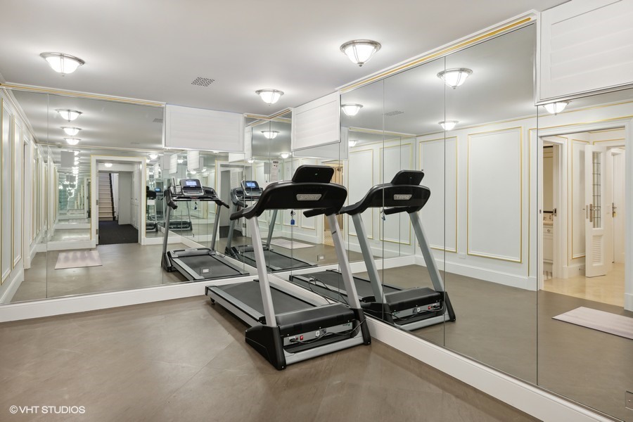 919 Hill Road Winnetka, IL 60093 - Photo 41 of 57 a room with gym equipment and white walls