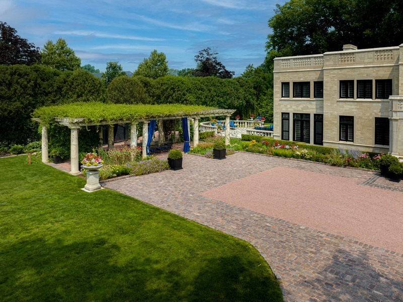 919 Hill Road Winnetka, IL 60093 - Photo 46 of 57 a front view of a house with a yard and trees