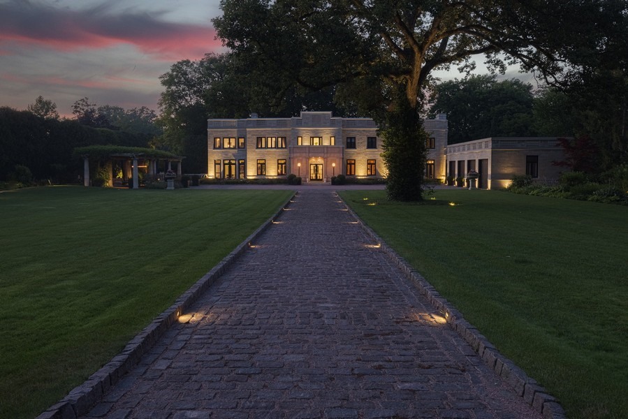 919 Hill Road Winnetka, IL 60093 - Photo 51 of 57 a front view of a house with a garden and yard