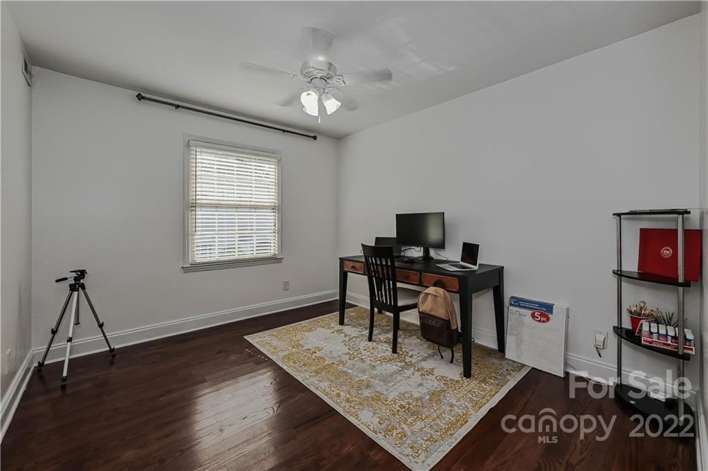 4919 Park Road, Unit D Charlotte, NC 28209 - Photo 22 of 27 a workspace with furniture window and wooden floor