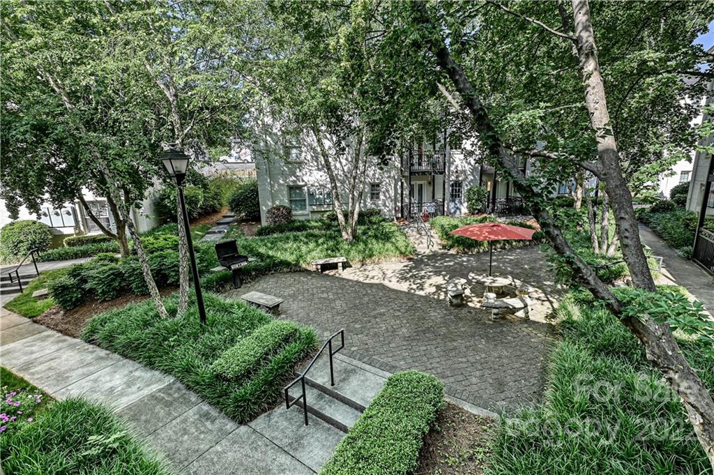 4919 Park Road, Unit D Charlotte, NC 28209 - Photo 24 of 27 a view of a backyard with sitting area