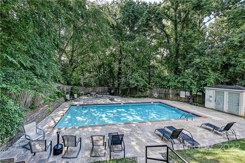 4919 Park Road, Unit D Charlotte, NC 28209 - Photo 27 of 27 an outdoor space with swimming pool and furniture