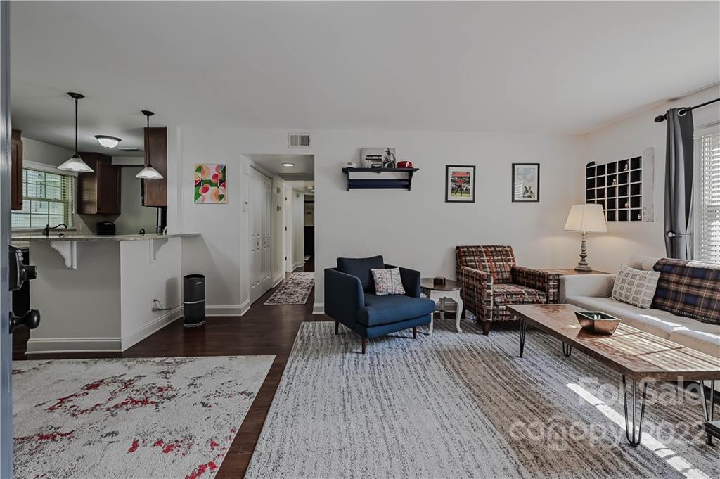 4919 Park Road, Unit D Charlotte, NC 28209 - Photo 3 of 27 a living room with furniture and wooden floor