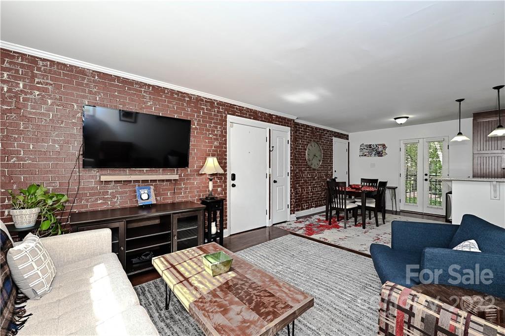 4919 Park Road, Unit D Charlotte, NC 28209 - Photo 4 of 27 a living room with furniture and a flat screen tv