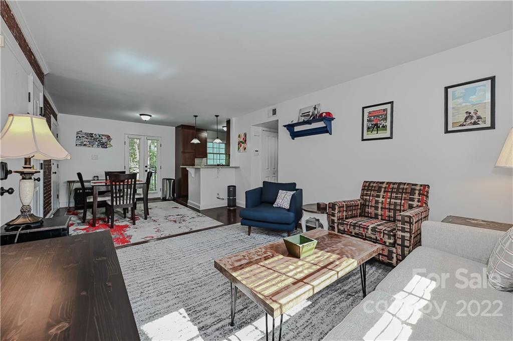 4919 Park Road, Unit D Charlotte, NC 28209 - Photo 5 of 27 a living room with furniture and wooden floor