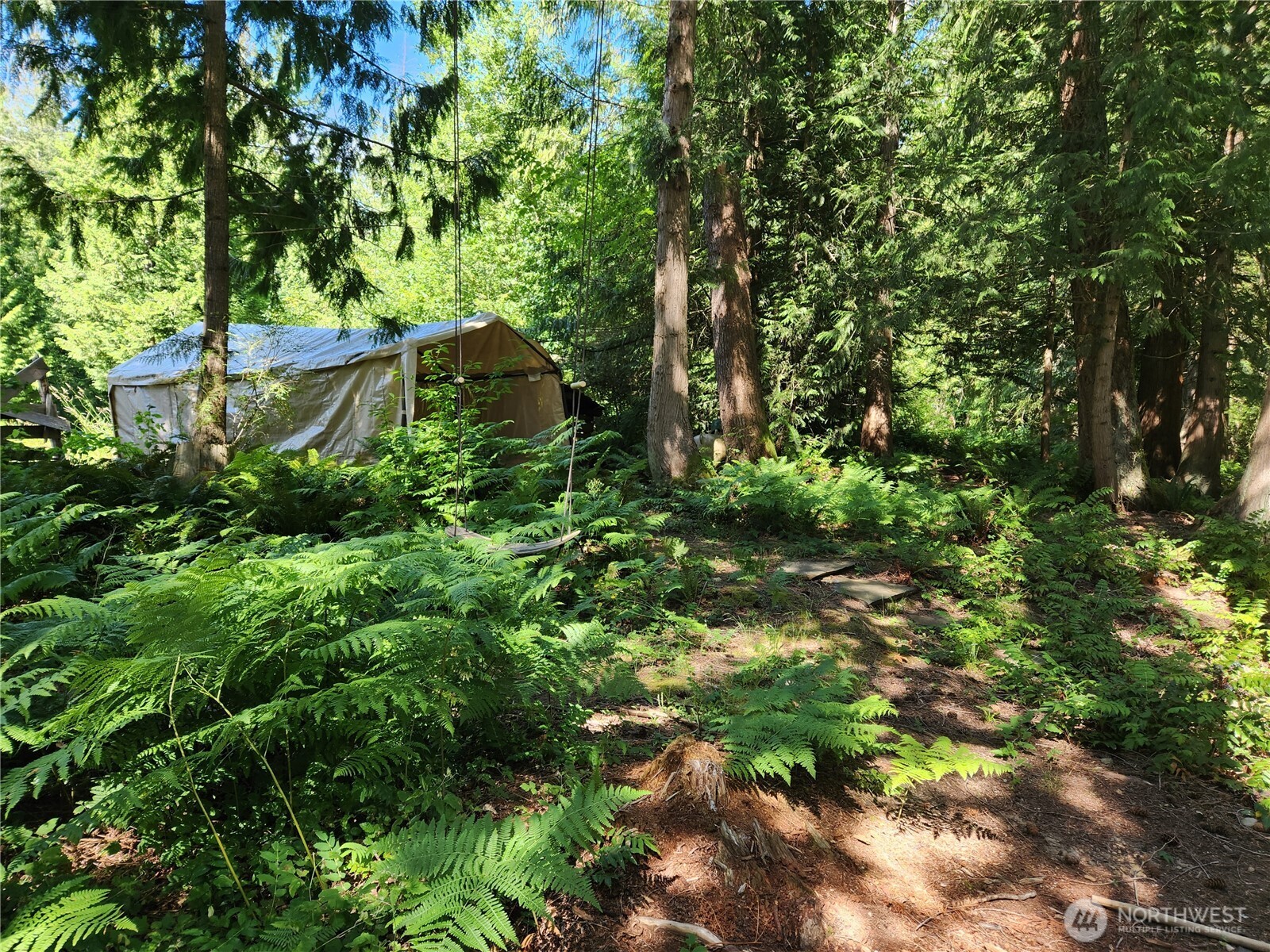 3226 Kelly Road Bellingham, WA 98226 - Photo 20 of 40 a backyard of a house with lots of green space and garden
