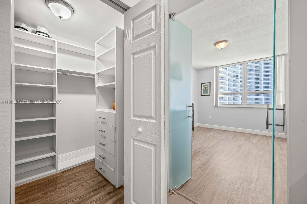 2000 North Bayshore Drive, Unit 1105 Miami, FL 33137 - Photo 19 of 29 a view of an empty room with wooden floor and a window