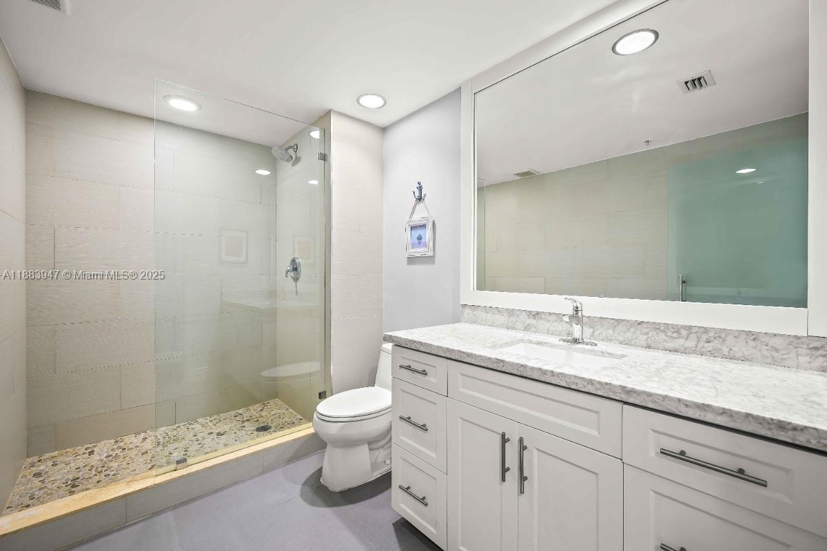 2000 North Bayshore Drive, Unit 1105 Miami, FL 33137 - Photo 23 of 29 a bathroom with a granite countertop sink toilet and shower