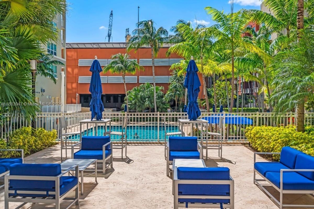 2000 North Bayshore Drive, Unit 1105 Miami, FL 33137 - Photo 24 of 29 a view of a chairs and table in the patio