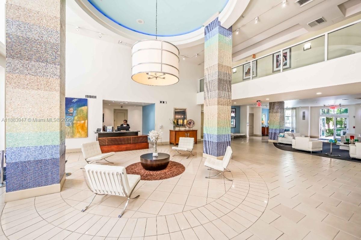 2000 North Bayshore Drive, Unit 1105 Miami, FL 33137 - Photo 5 of 29 a view of a livingroom with furniture and chandelier