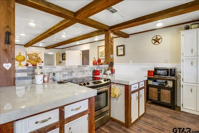 a kitchen with a stove and a refrigerator