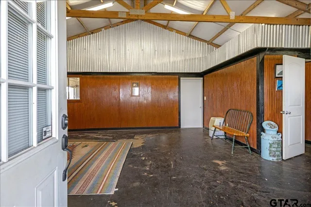 a view of an entryway with wooden floor