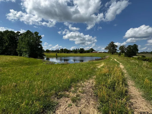 a view of a lake with a big yard