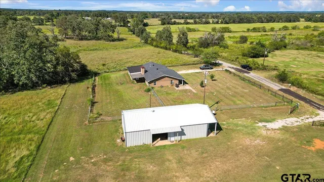 a view of a pool in a yard with an outdoor space